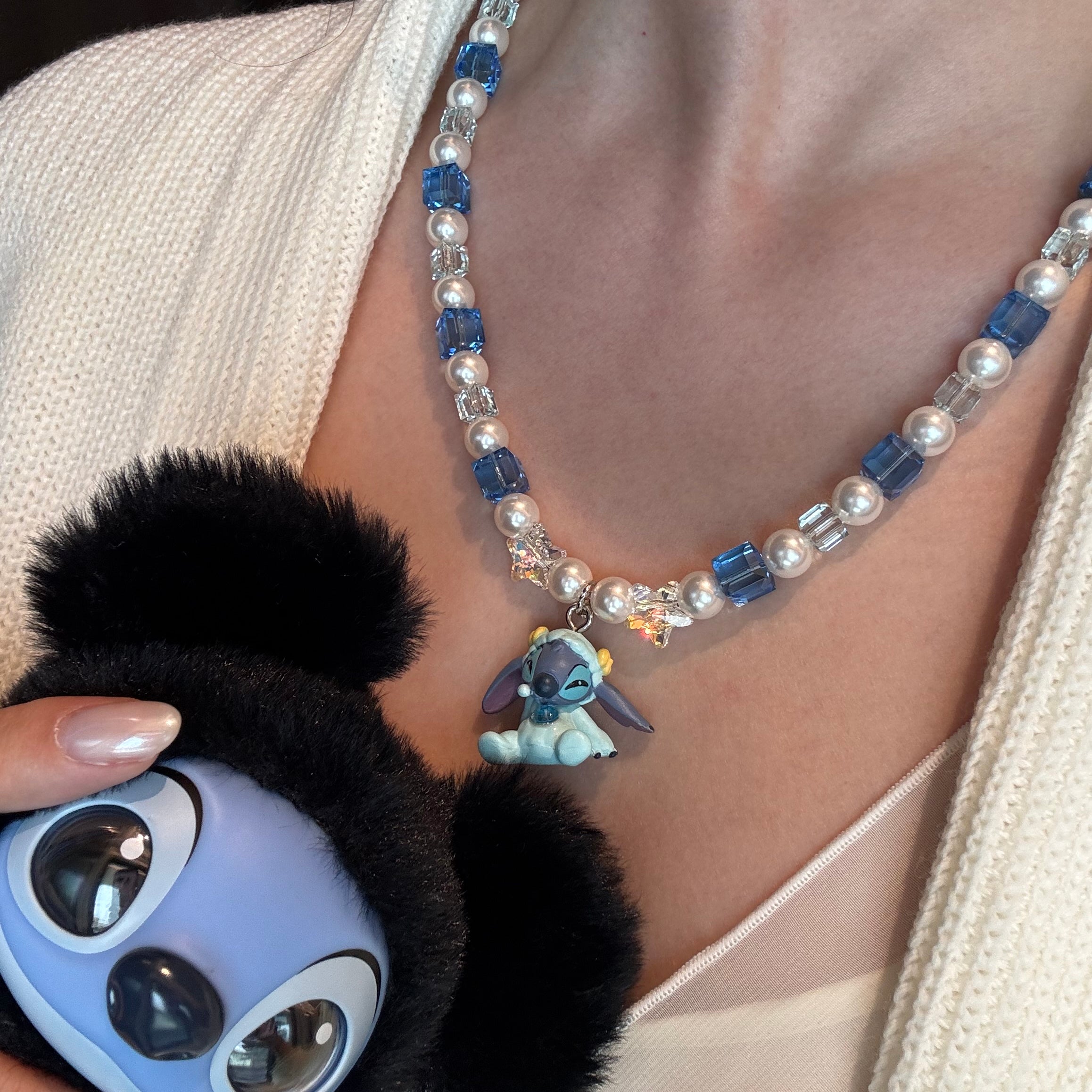 Gift-ready ShinoraStudio packaging for a handmade blue Swarovski crystal charm necklace with cosmic-inspired collectible charm details