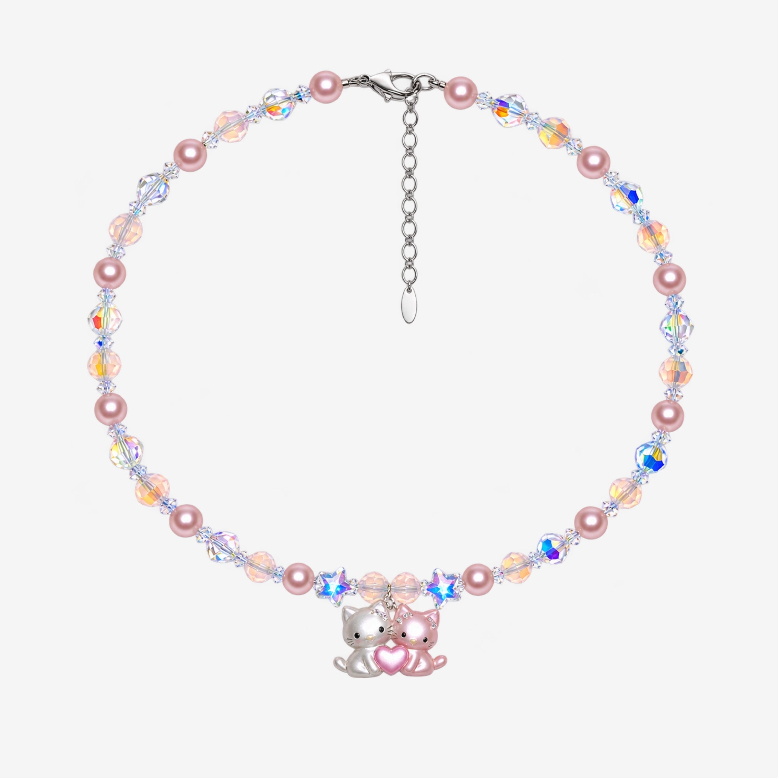 Necklace with pink Swarovski crystal pearls, peach and iridescent crystals, two stars and a pink-and-white cat duo pendant with a heart.