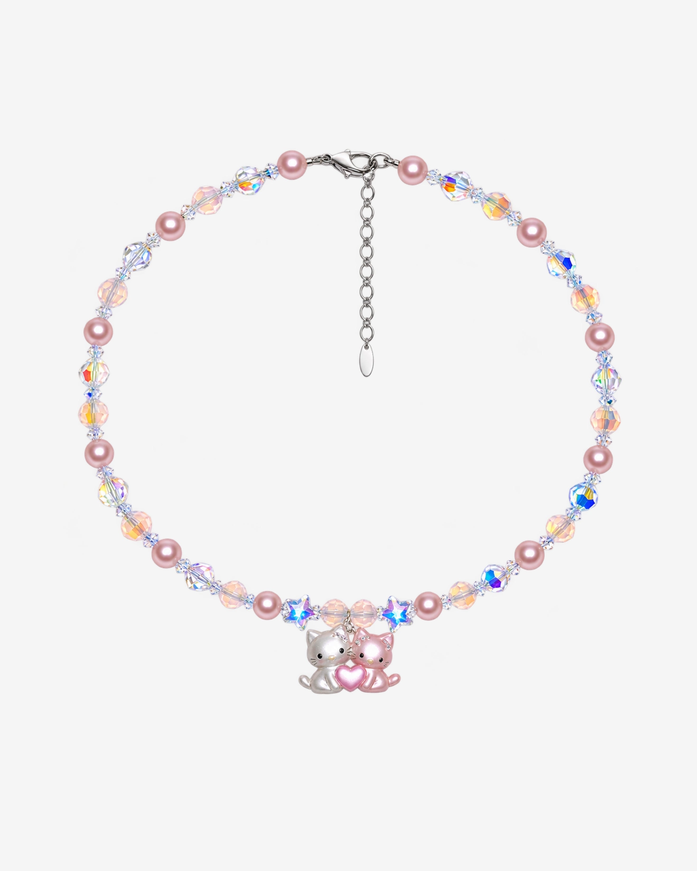 Necklace with pink Swarovski crystal pearls, peach and iridescent crystals, two stars and a pink-and-white cat duo pendant with a heart.