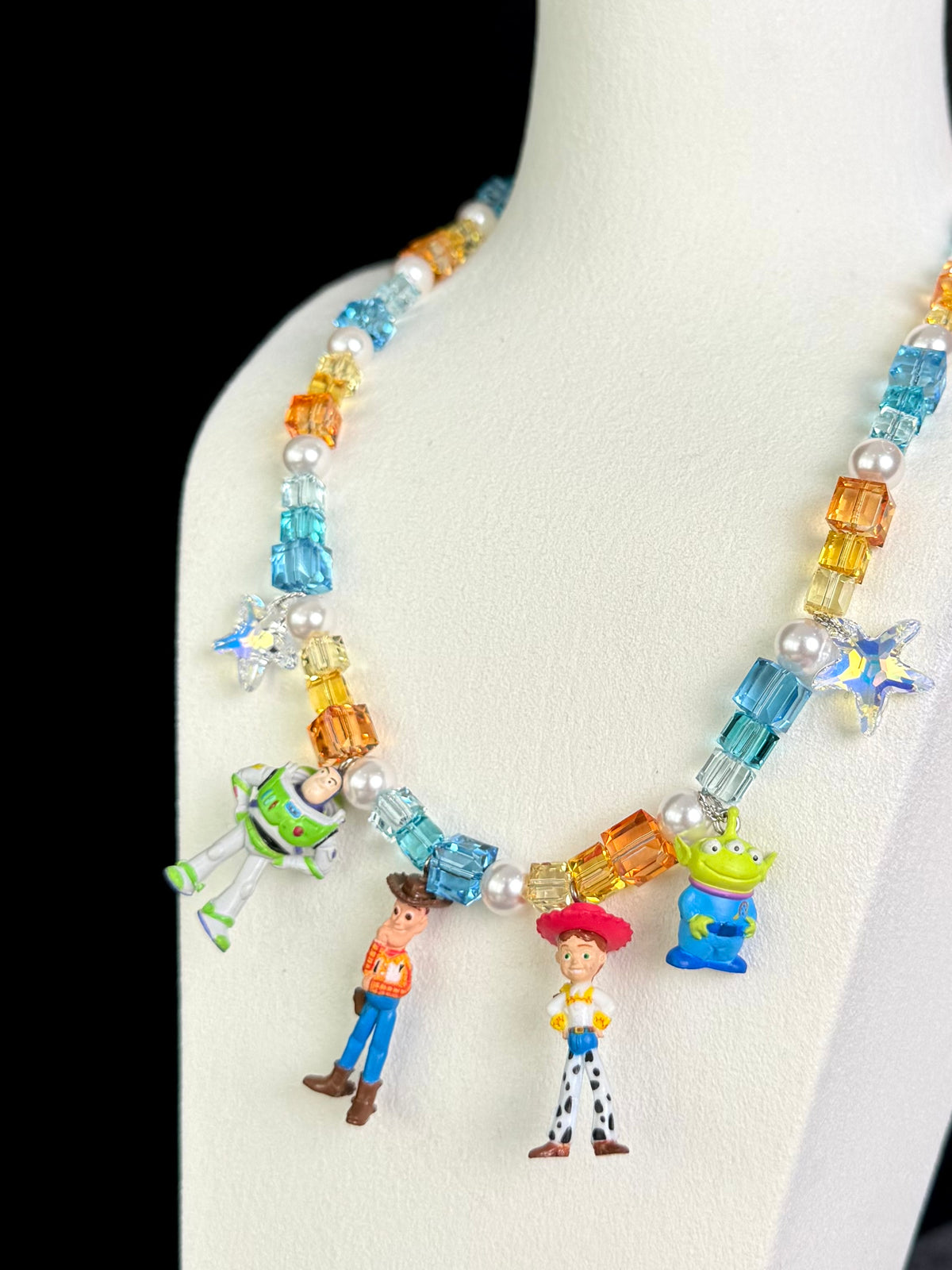 Vintage Toy Story character pendants on handmade Y2K multi-charm Swarovski necklace - detail view